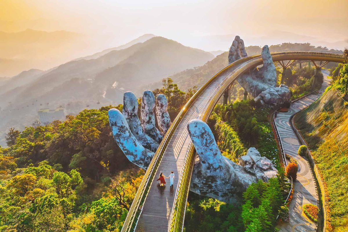 Travelers on the Golden Bridge at Ba Na Hills
