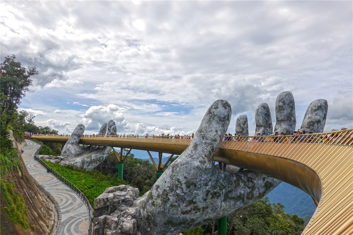 Visitors walking along the Golden Bridge